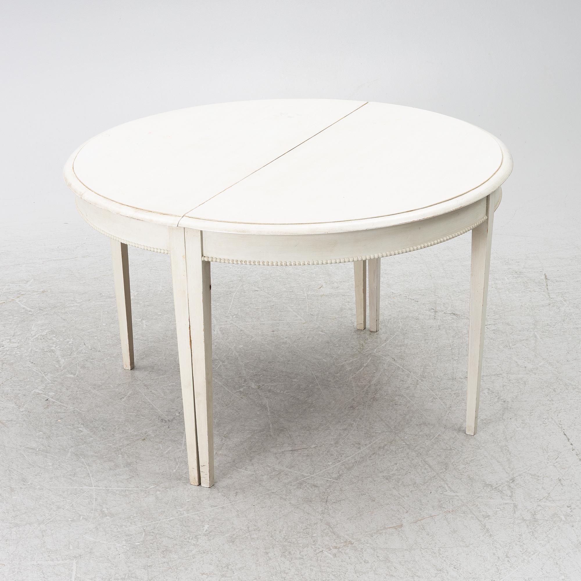 A Gustavian style dining table, late 20th Century.