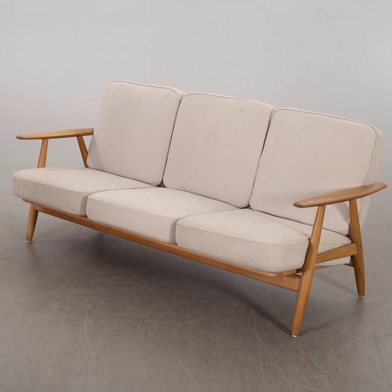 HANS J WEGNER, a Cigarren oka sofa Getama möbler Denmark later part of the 20th century.