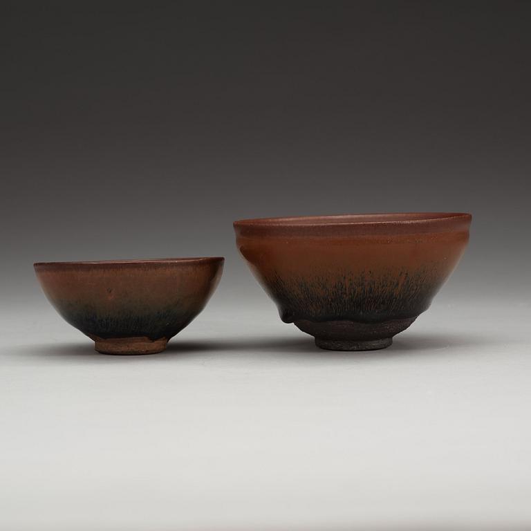 Two temmoku tea bowls, with 'hare's fur' glaze, the glaze pooling short of the unglazed feet. Song dynasty (960-1279).