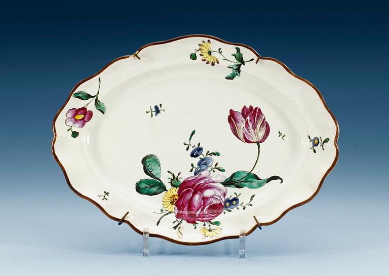 A German faience charger, 18th Century.