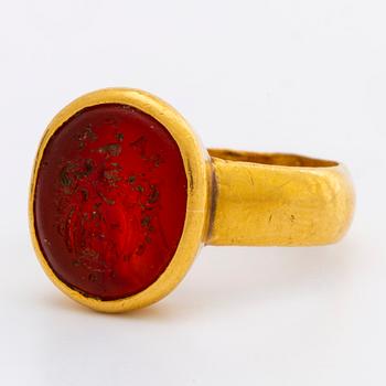 A signet carnelian ring.