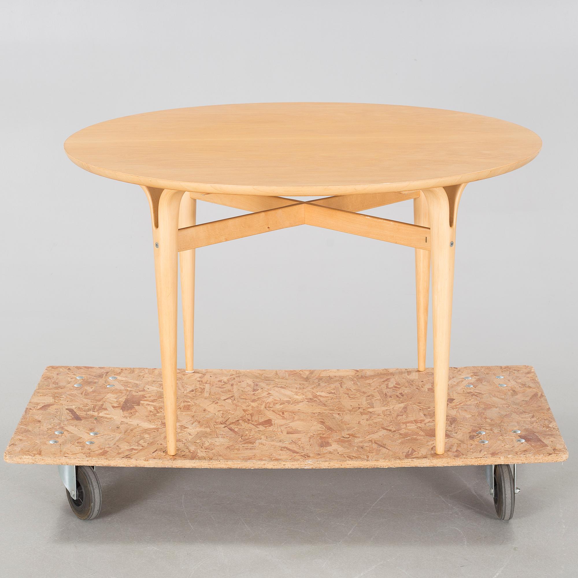 a coffee table from Firma Karl Mathsson, Värnamo, dated 1986.