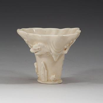 A blanc de chine rhinoserous libation cup, Qing dynasty, Kangxi (1662-1722).