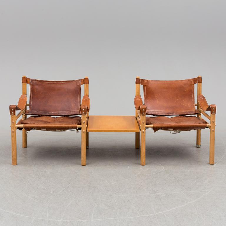 A pair of easy chairs by Arne Norell with a table leaf.