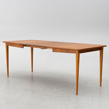 A mid20th century dining table.