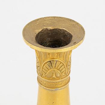 A bronze and porphyry candlestick, 20th Century.