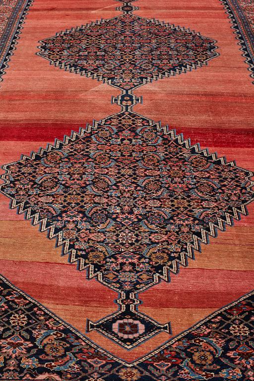 A CARPET, an antique Bidjar kelly, ca 587 x 230 cm.