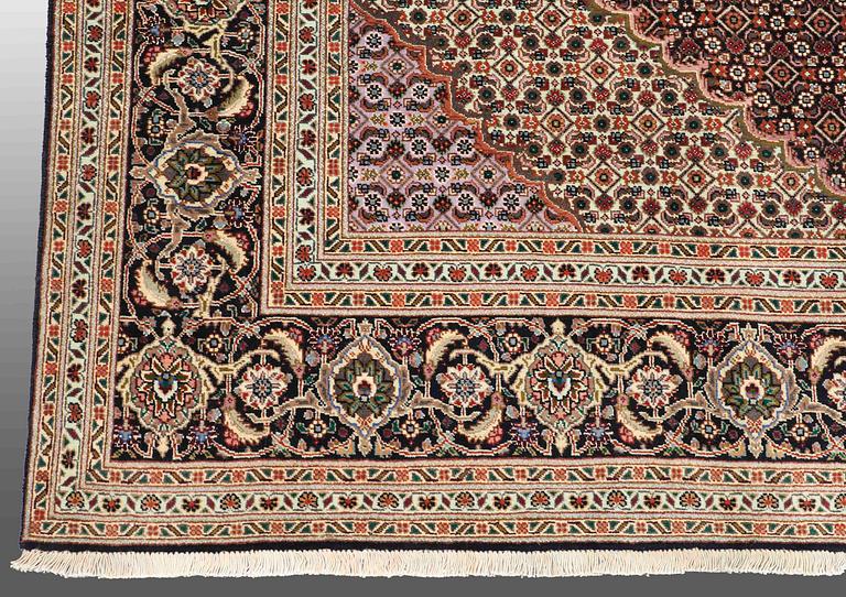 A CARPET, Tabriz part silk , so called 40 Radj, ca 298 x 202 cm.