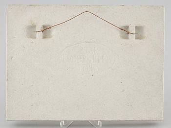 A stoneware wall plaque by Stig Lindberg, signed in the ceramics.