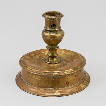 A 17th century bronze candlestick.