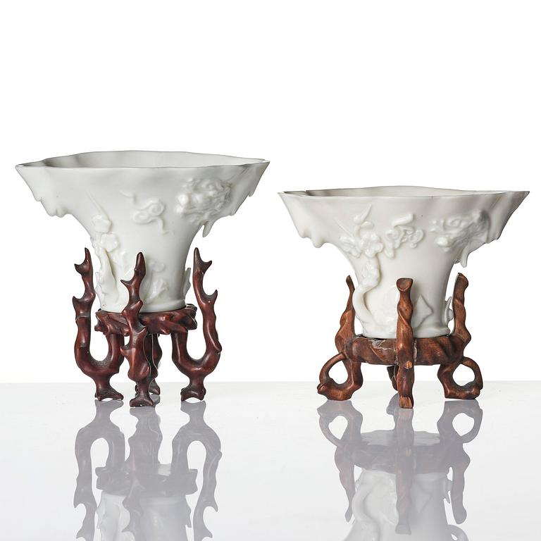 A pair of blanc de chine rhinoceros libation cups, Qing dynasty, Kangxi (1662-1722).