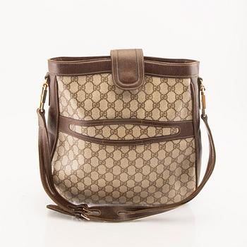 Gucci, a shoulder strap bag.