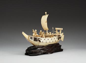 A Japanese ivory model of a ship with fishermen, Meiji period ca 1900.