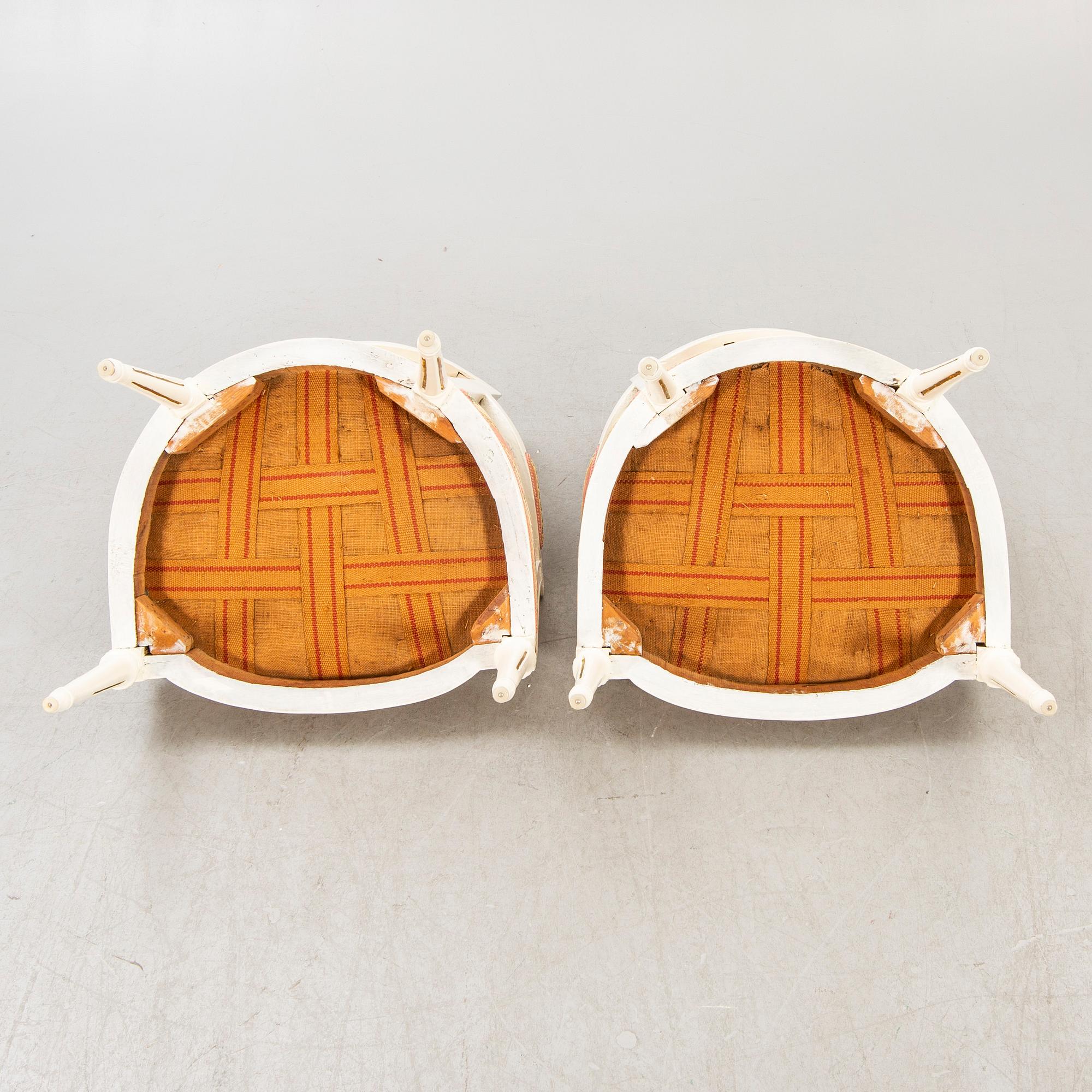 A pair of Swedish painted late Gustavian armchairs around 1800.