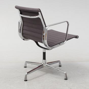 An 'EA 104 Swivel' armchair by Charles & Ray Eames, Vitra, 2007.
