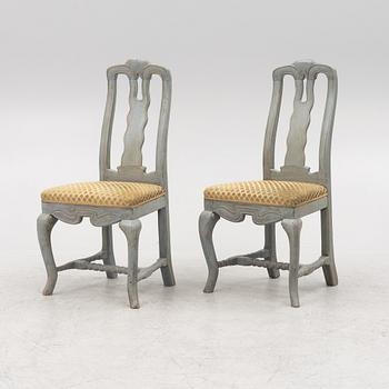 A pair of Baroque style chairs with older parts.