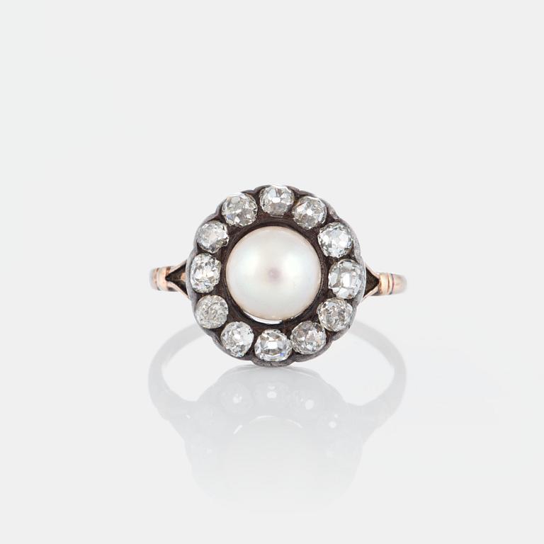 A pearl ring set with old-cut diamonds.