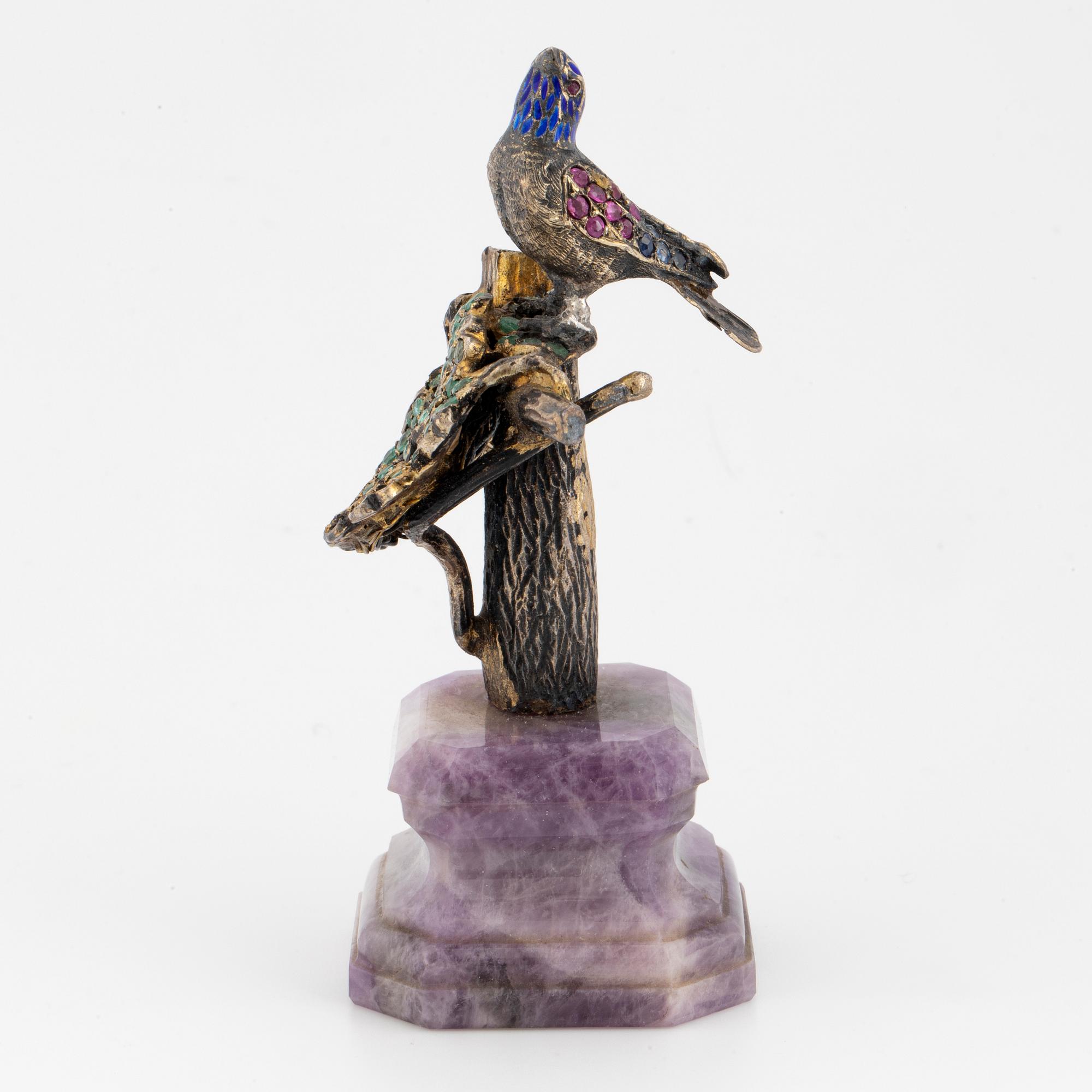 Silver and coloured stone bird sculpture.