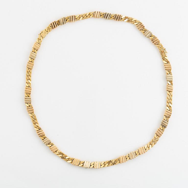 An 18K gold necklace/bracelet combination set with brilliant-cut diamonds.