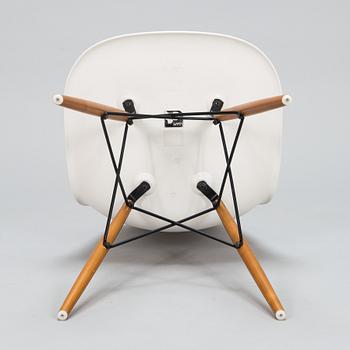 A 'Plastic chair DSW' by Charles and Ray Eames for Vitra.