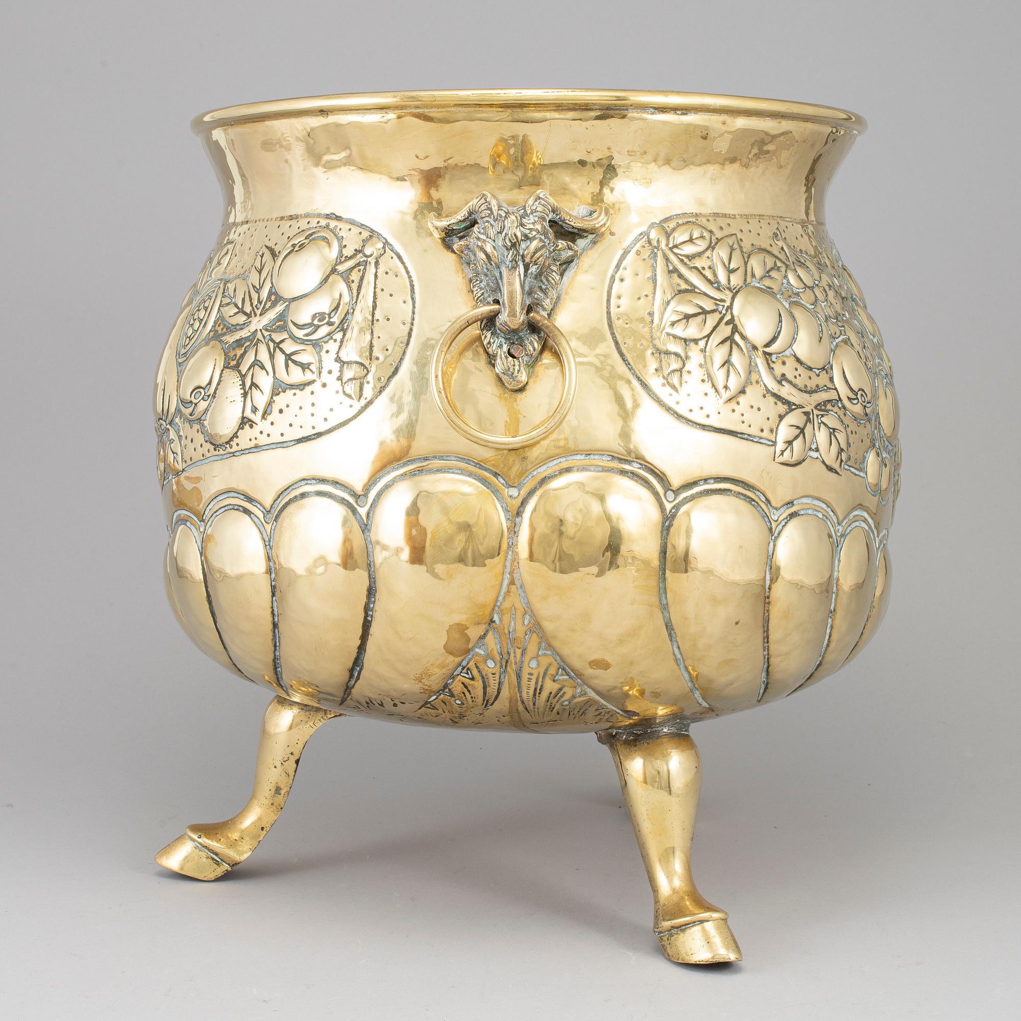 A 19th century brass champagne cooler.
