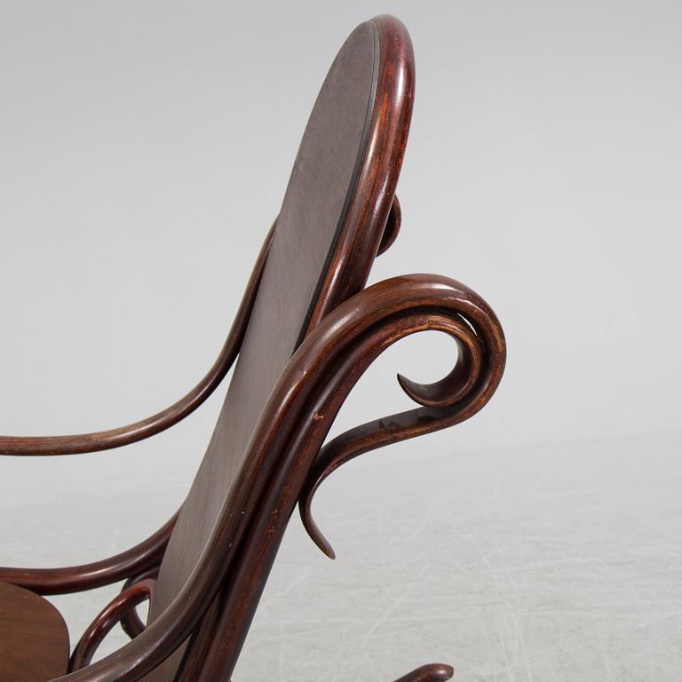 A stained rocking chair by Thonet, about 1900.