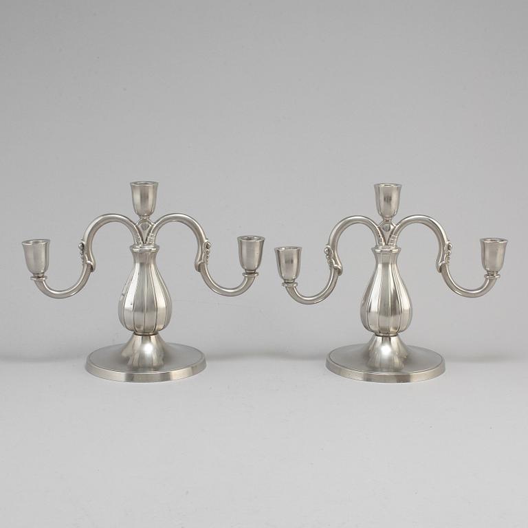A pair of pewter candelabra from GAB Tenn, Stockholm, 1935.