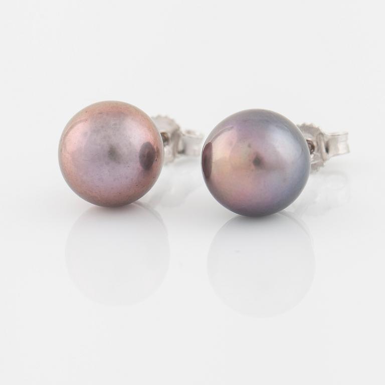 A pair of cultured Tahiti pearls.