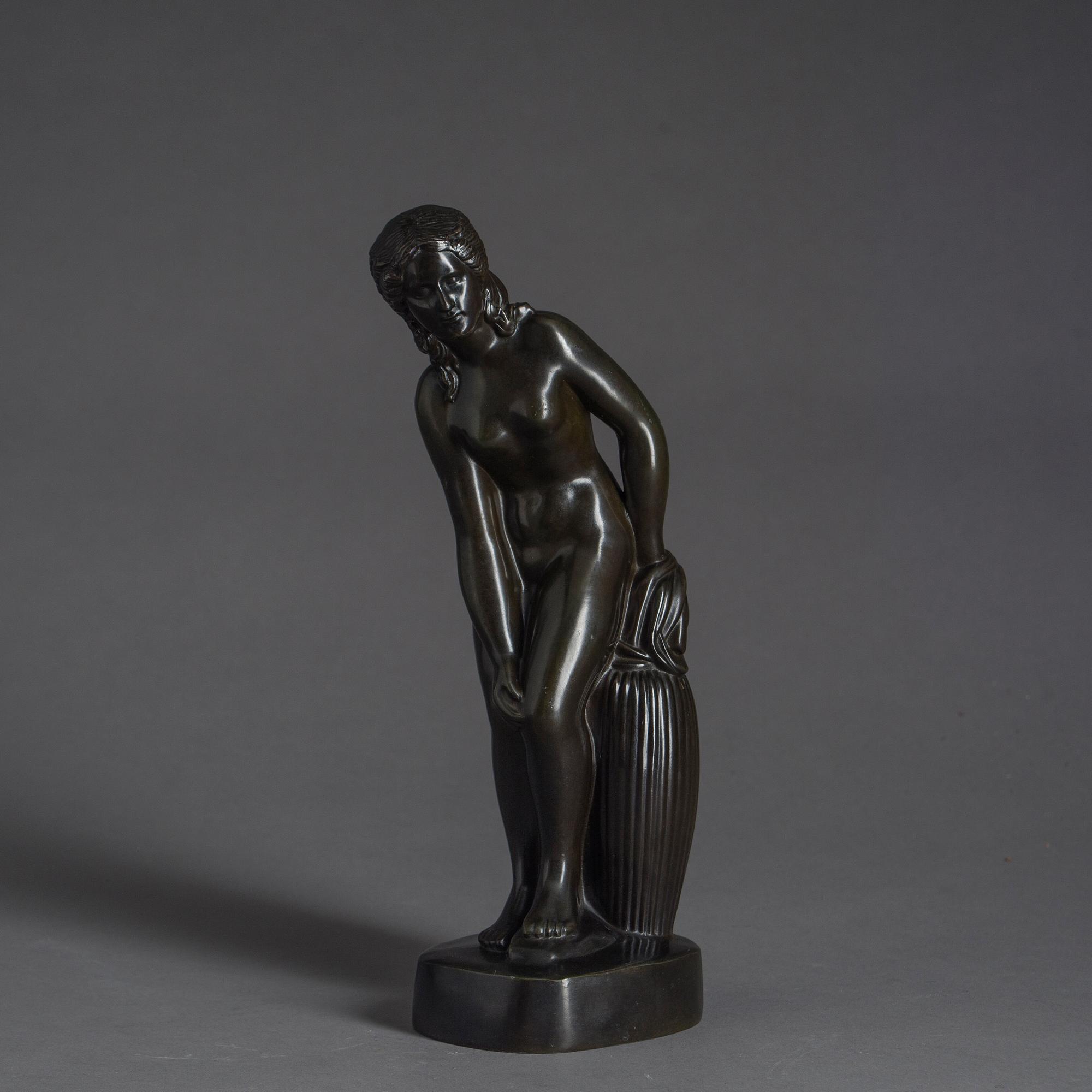 JUST ANDERSEN, a signed metal sculpture.