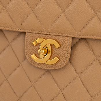 Chanel, a beige caviar leather bag, 1996-1997.