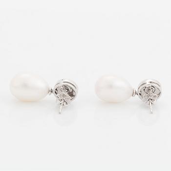A pair of 18K white gold and cultured pearls earrings set with round brilliant-cut diamonds.