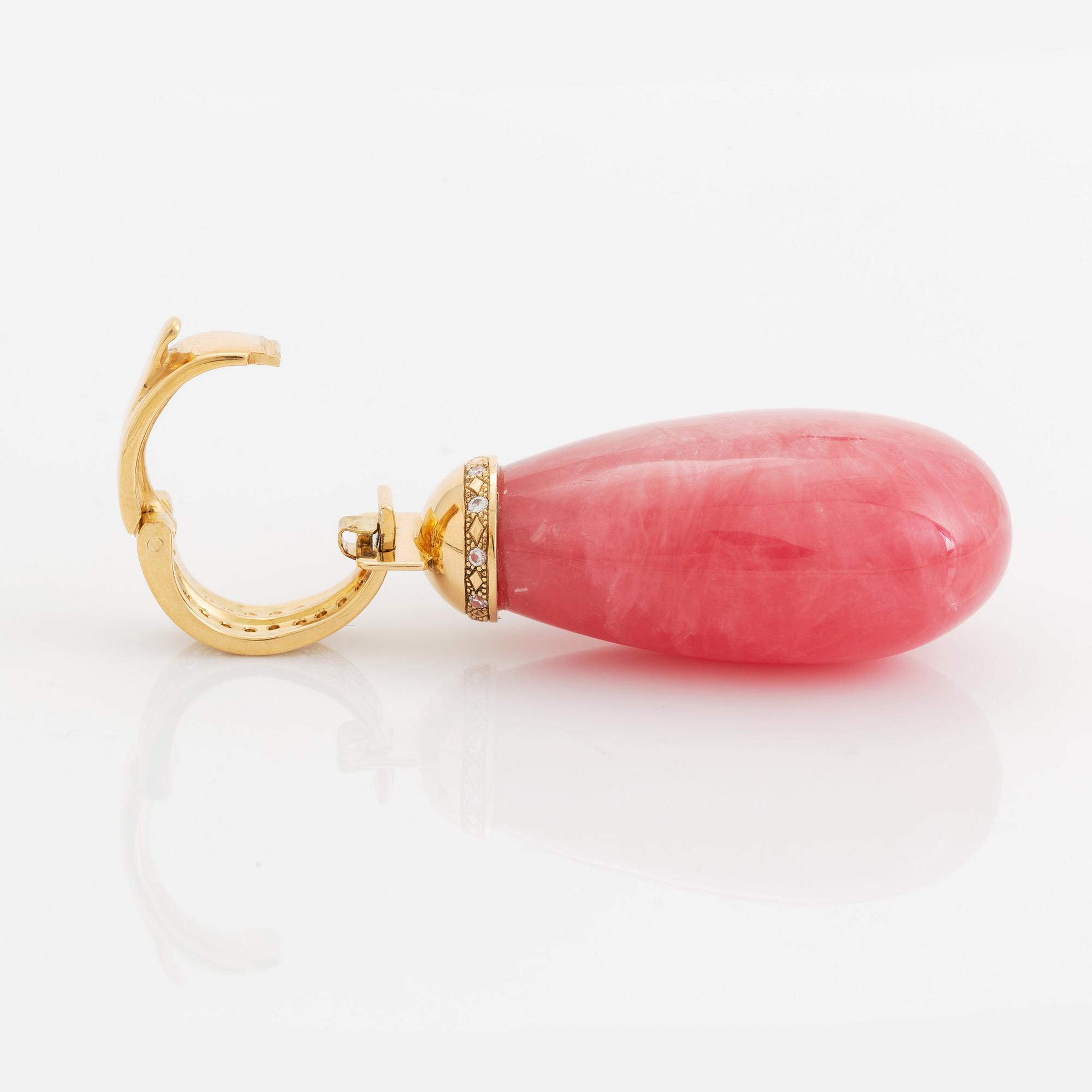 An 18K gold and rhodochrosite Acchinelli pendant set with round brilliant-cut diamonds.