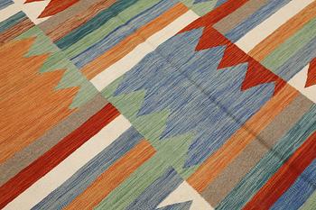 A Kelim carpet, c. 242 x 178 cm.