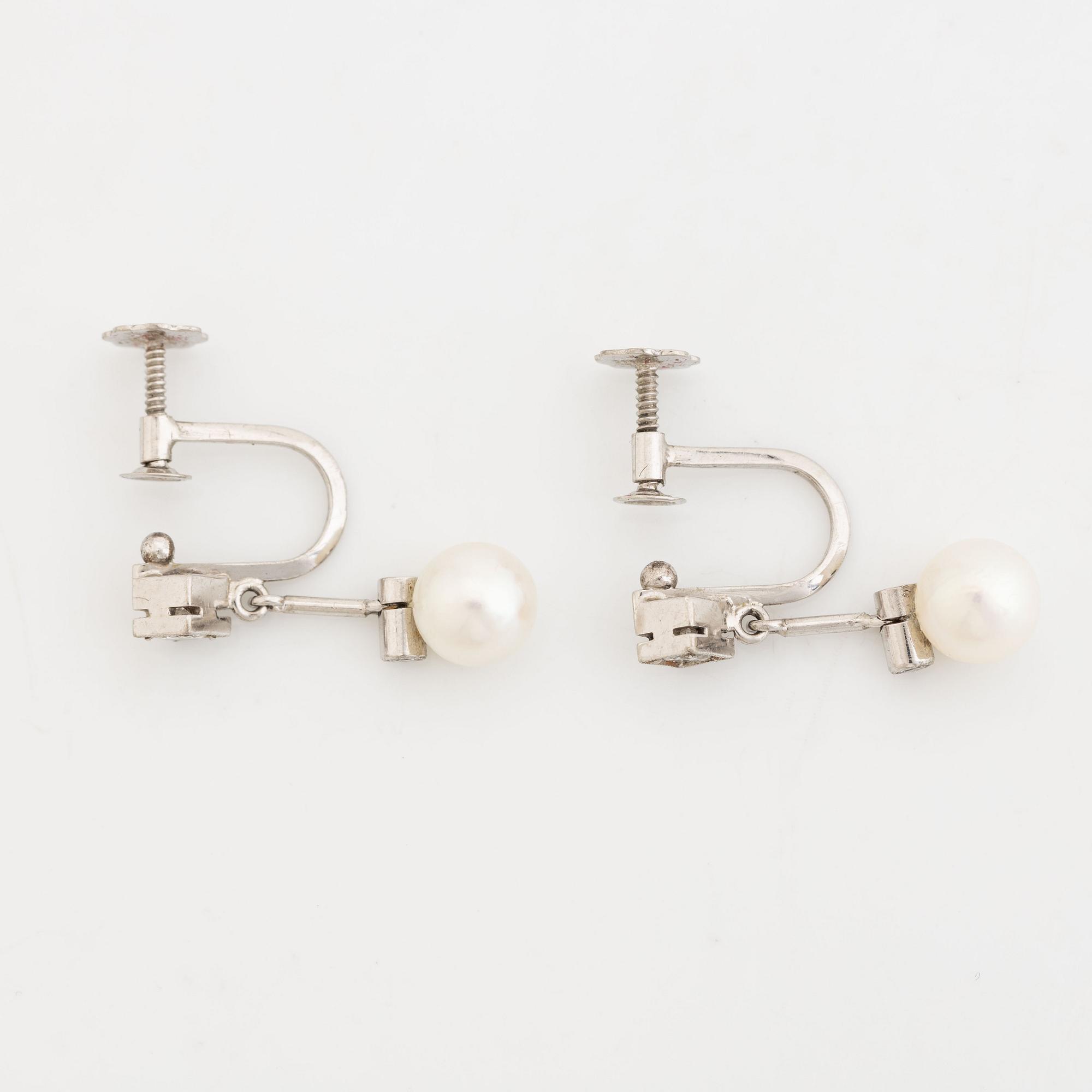 Cultured pearl and diamond earrings.