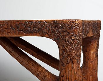 Gustaf Fjaestad, an Art Nouveau carved pine table, Arvika Sweden 1914, a double to the table in the Thiel Collection,