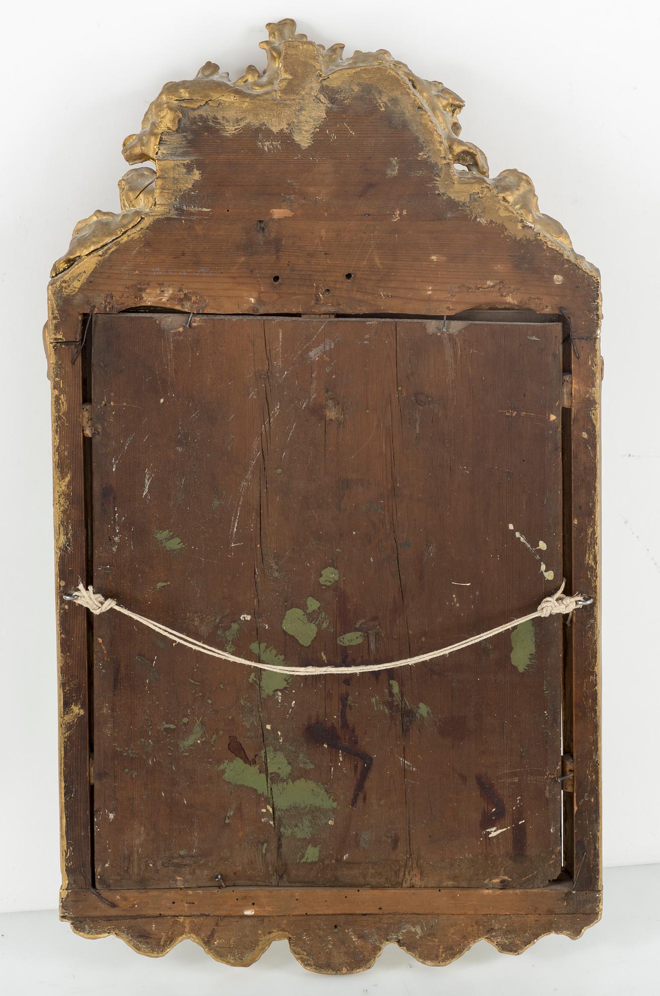 A rococo mirror, 18th century.