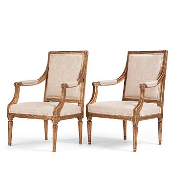 59. A near pair of Gustavian giltwood fauteuils, Stockholm, late 18th century.