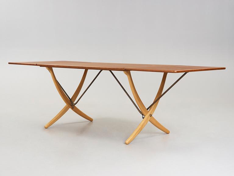 A Hans J Wegner teak and beech dinner table by Andreas Tuck, Denmark 1950-60's.