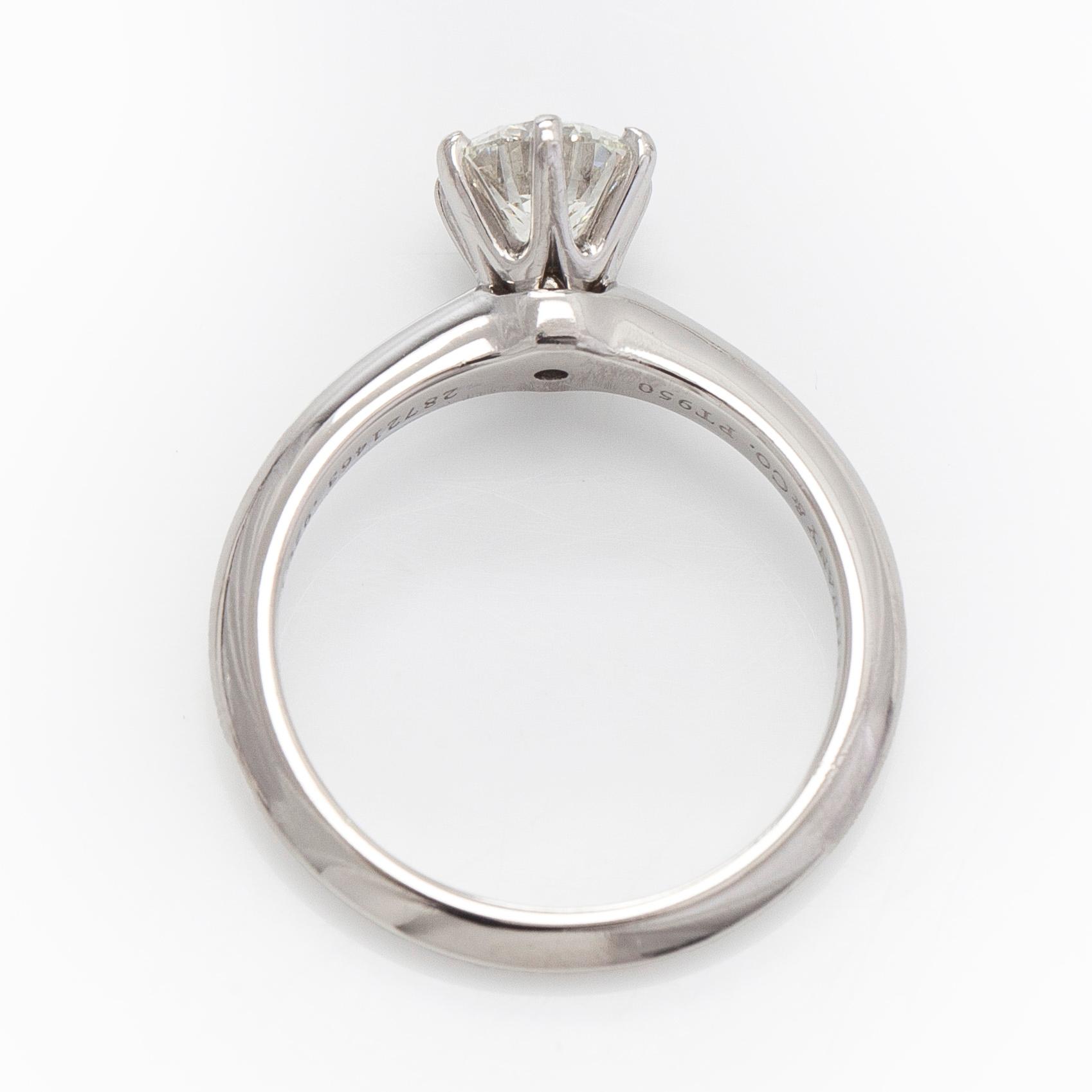 Tiffany & Co, a platinu solitaire ring with a brilliant-cut diamond.