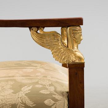 A pair of early 20th century Empire style armchairs.