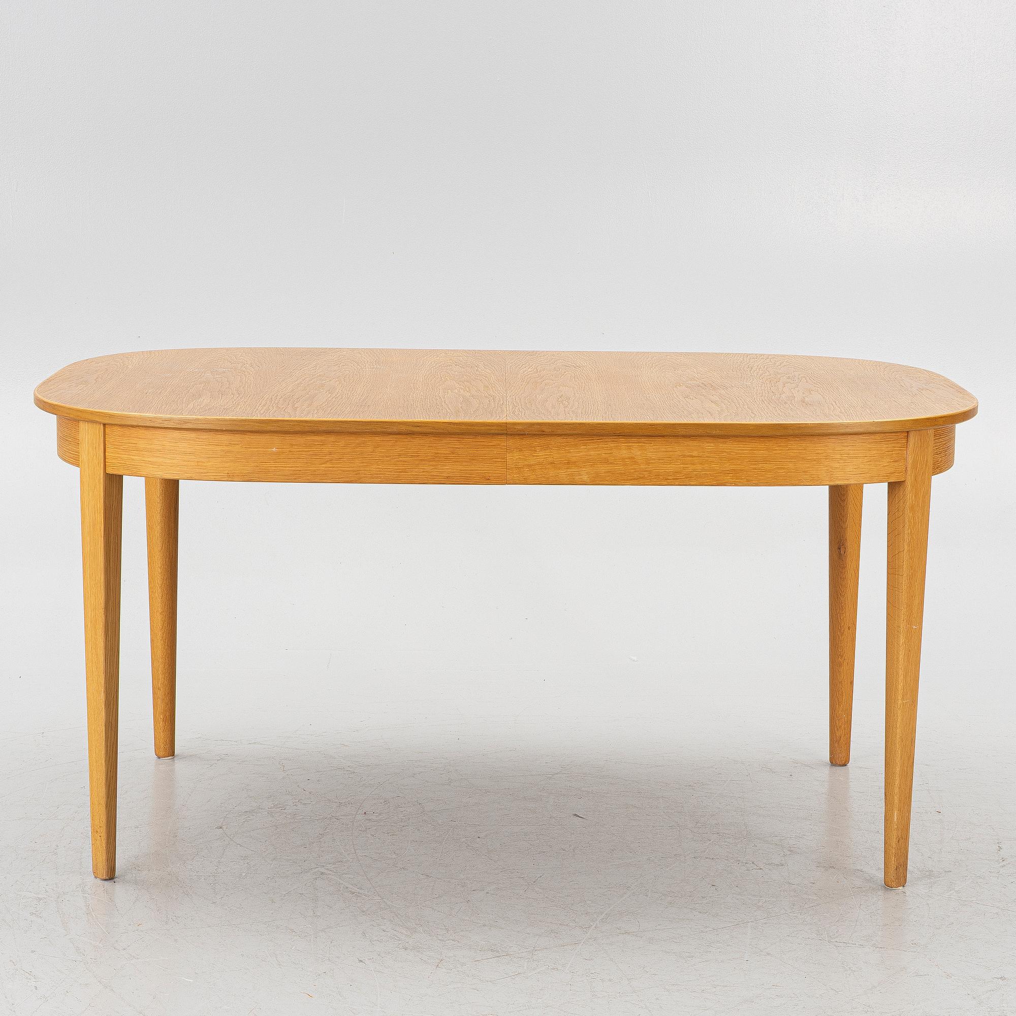 Carl Malmsten, Dining table with 6 chairs, “Ambassadör”, second half of the 20th century.