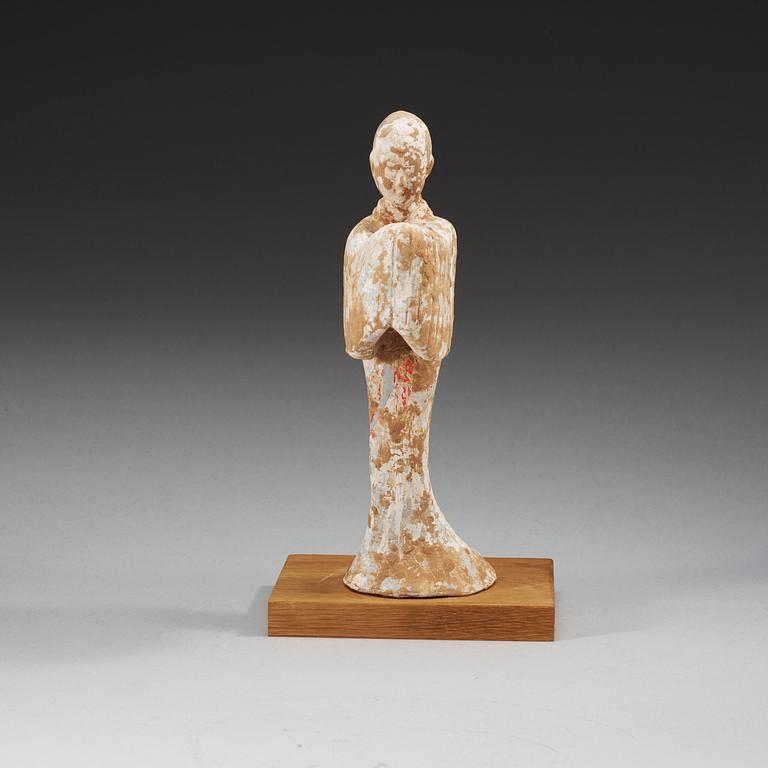 A potted figure of a court lady, Han dynasty (206 BC - 220 AD).
