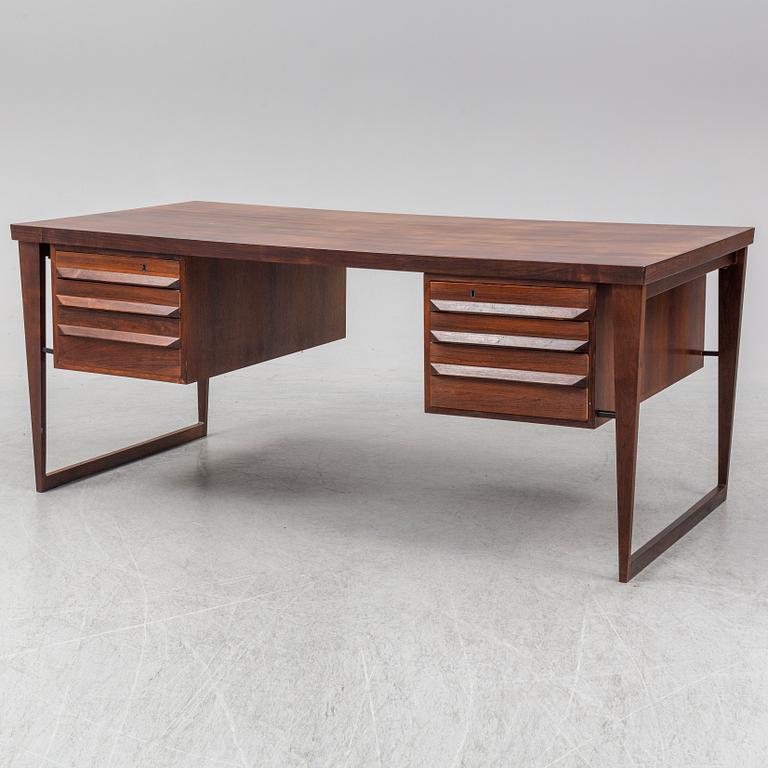 A 1960's rosewood desk by Kai Kristiansen, Feldballes Møbelfabrik, Denmark.