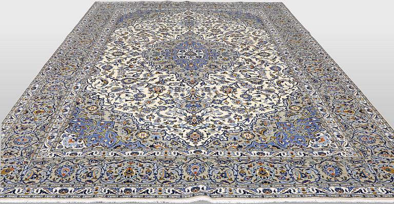 A Keshan carpet, signed, 386 x 281 cm.