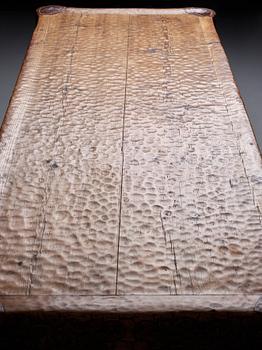 Gustaf Fjaestad, an Art Nouveau carved pine table, Arvika Sweden 1914, a double to the table in the Thiel Collection,