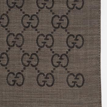 Gucci, a wool and silk mix "GG" jaquard shawl.