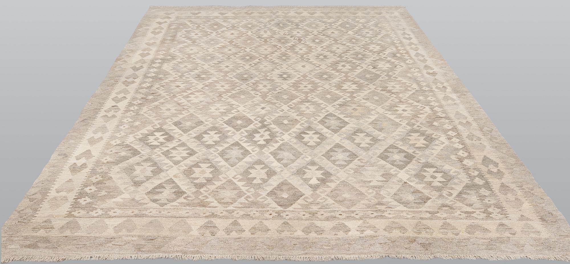 A kilim carpet, ca 290 x 208 cm.