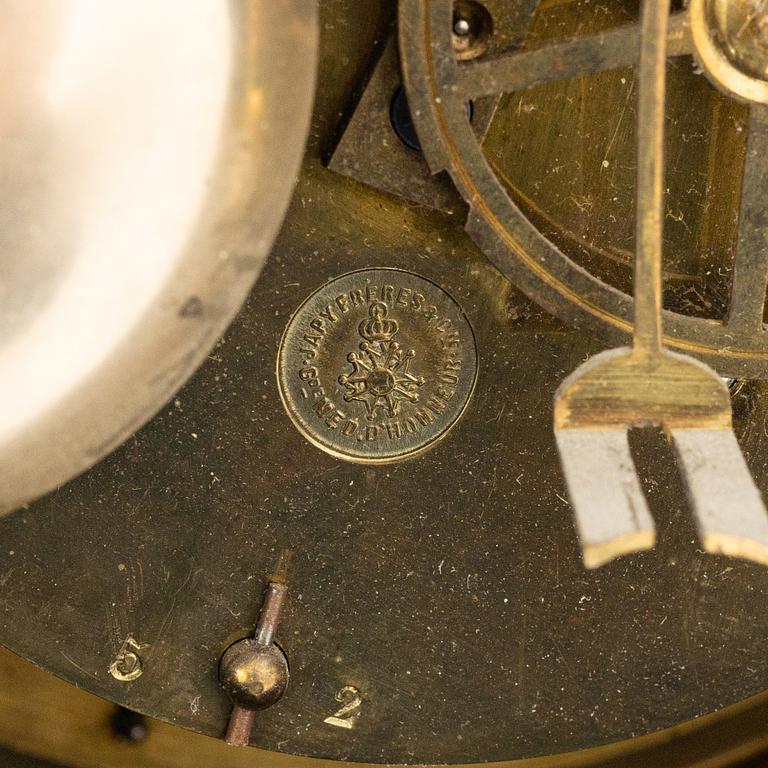 A bronze wall clock, Louis XVI style, France, circa 1900.