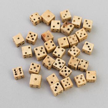 A COLLECTION OF 32 BONE MINIATURE DICE, 19th century.