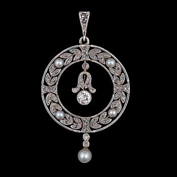 1162. A diamond and natural pearl pendant, c. 1905.